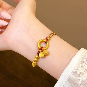 A woman wearing Gold-Plated Lotus Bracelet