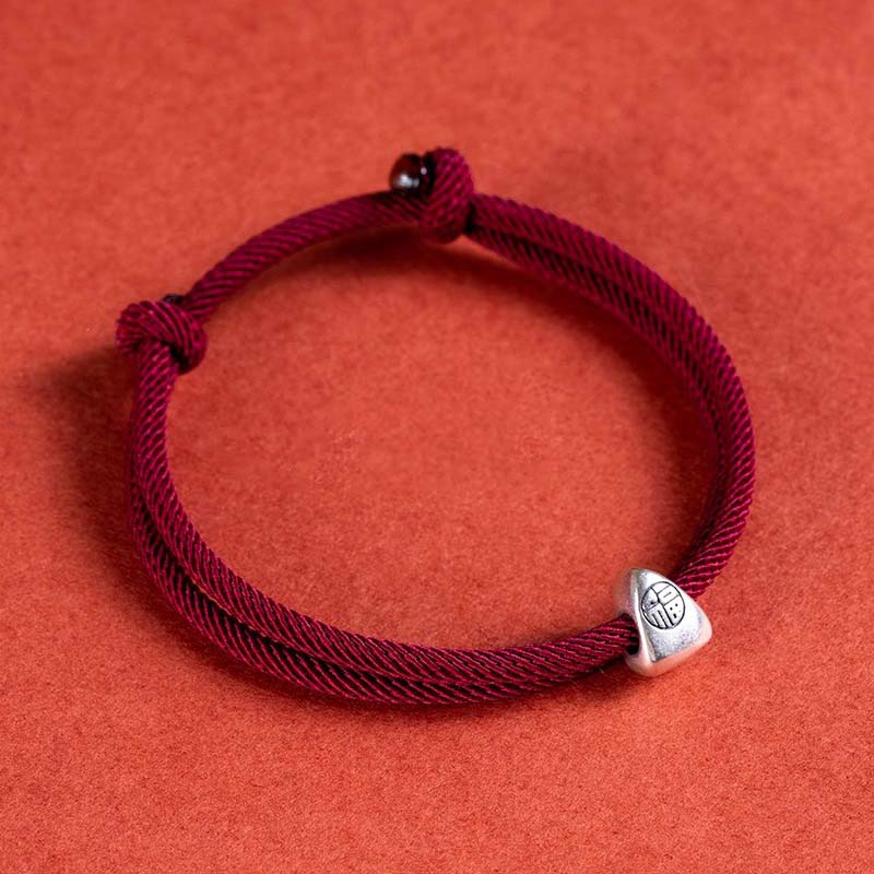 Hand-woven red rope 925 silver bracelet detail close-up