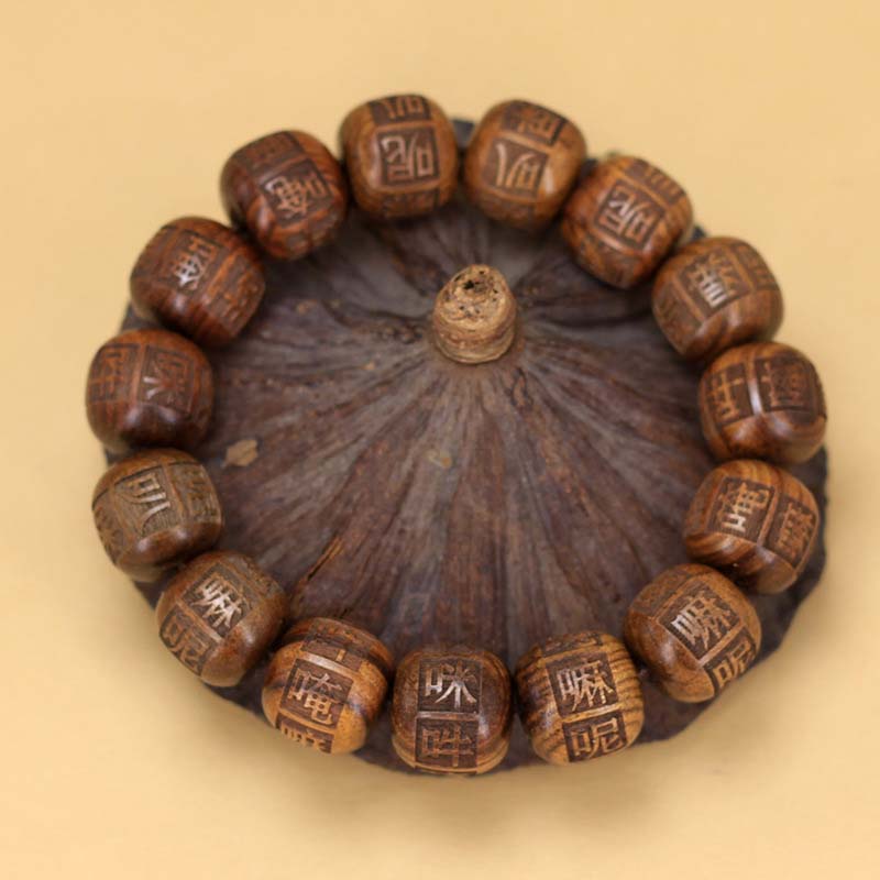 Tibetan Black Pear Wood Bracelet Engraved with Om Mani Padme Hum: Spiritual Grace in Every Bead