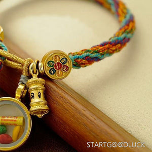 Tibetan Hand - Braided Bracelet with Yellow Jambhala Thangka: Attract Wealth - StartGoodLuck